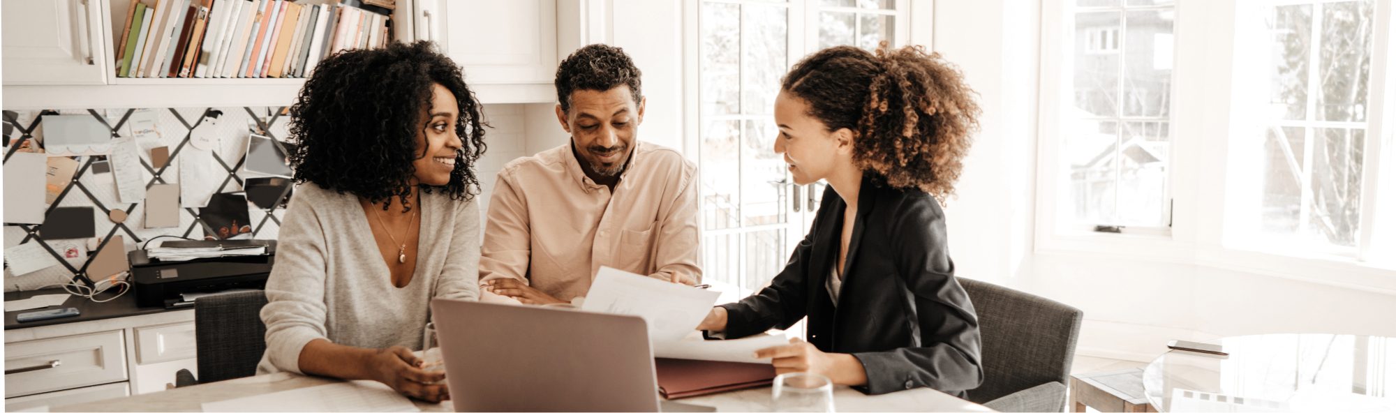 Two Individuals talking with their Financial Advisor